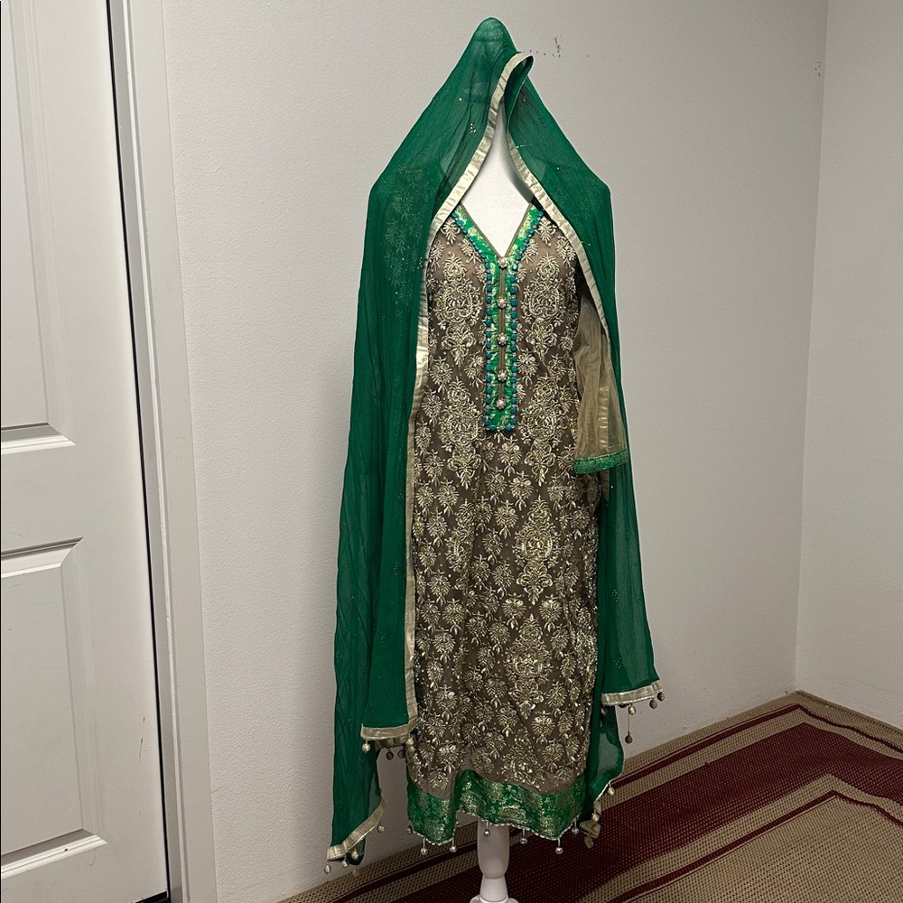 Green three piece salwar kameez suit